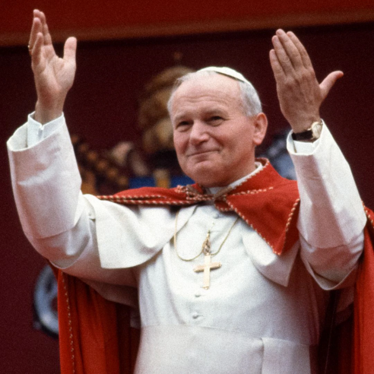 0c73ff8bb391-pope-john-paul-ii-raises-his-arms-in-greeting-after-his-speech-at-chapel-of-st-p
